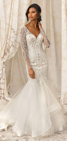 fit-and-flare wedding dress from justin alexander with long sheer lace sleeves and ruffled skirt