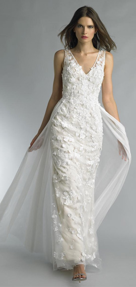 form-fitting v-neck white wedding dress from basix bridal with lace overlay around embroidered skirt