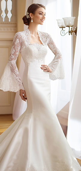 a two-piece strapless bridal dress set from david tutera for mon cheri with a lace bolero jacket with matching eyelash long bell sleeves